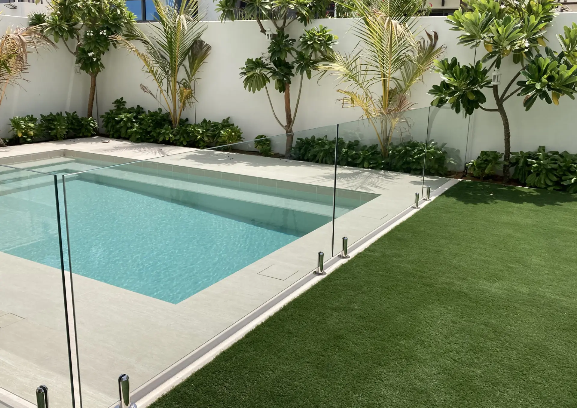 Frameless glass pool fence at a Dubai villa